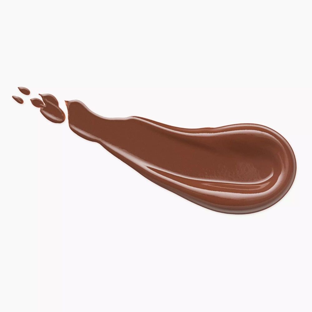 Brauner Bronzer-Strich auf weißem Hintergrund. Der Strich ist unregelmäßig geformt und glänzend.