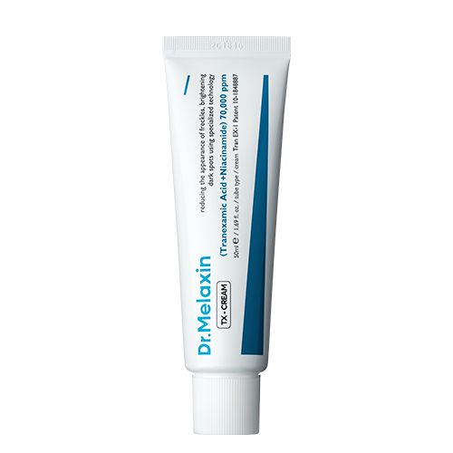 Weiße Tube mit blauer Beschriftung. Aufschrift: Dr.Melaxin TX-CREAM. Enthält Tranexamsäure und Niacinamid.
