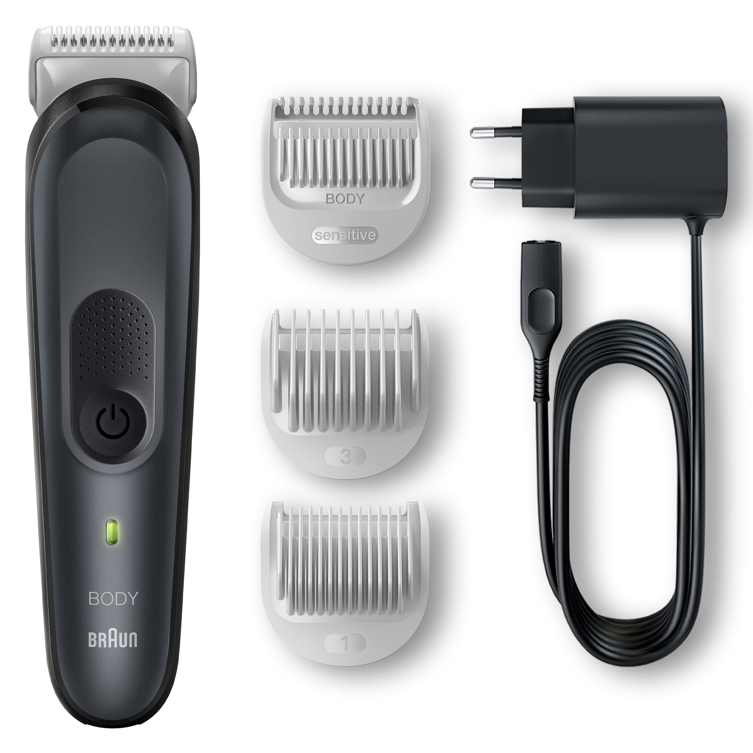 Braun BodyGroomer in Grau. Rasierer, drei Aufsätze, Ladegerät mit Kabel. Aufsätze: 1mm, 3mm, Sensitive. Schwarzes Ladegerät.