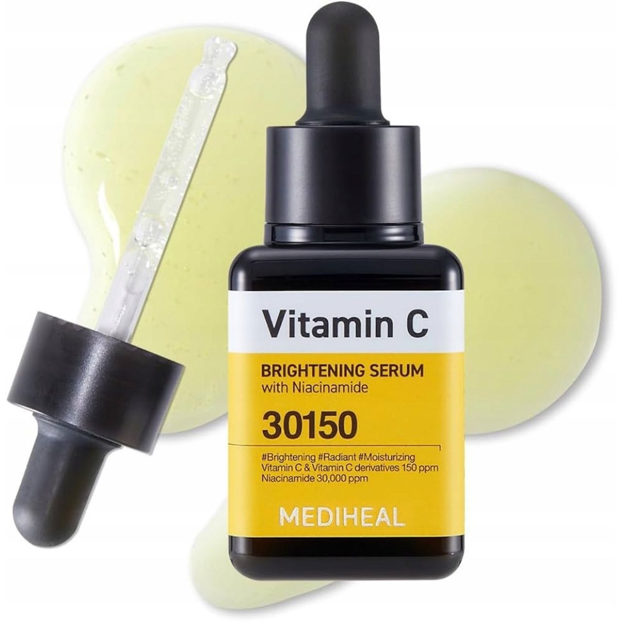 Mediheal Vitamin C Serum Flasche mit Pipette, umgeben von Serumtröpfchen. Gelbes Etikett mit Produktinformationen.