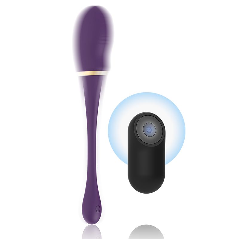 Lila Vibrator mit goldfarbenem Ring. Tropfenförmige Basis. Abgerundete Form. Mit schwarzem Zubehör.