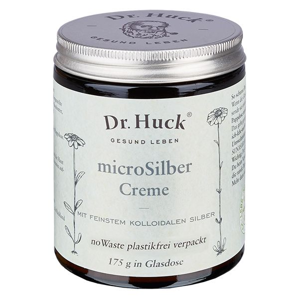 Glasdose mit silbernem Deckel und Aufschrift Dr. Huck microSilber Creme. Mit floralen Illustrationen.