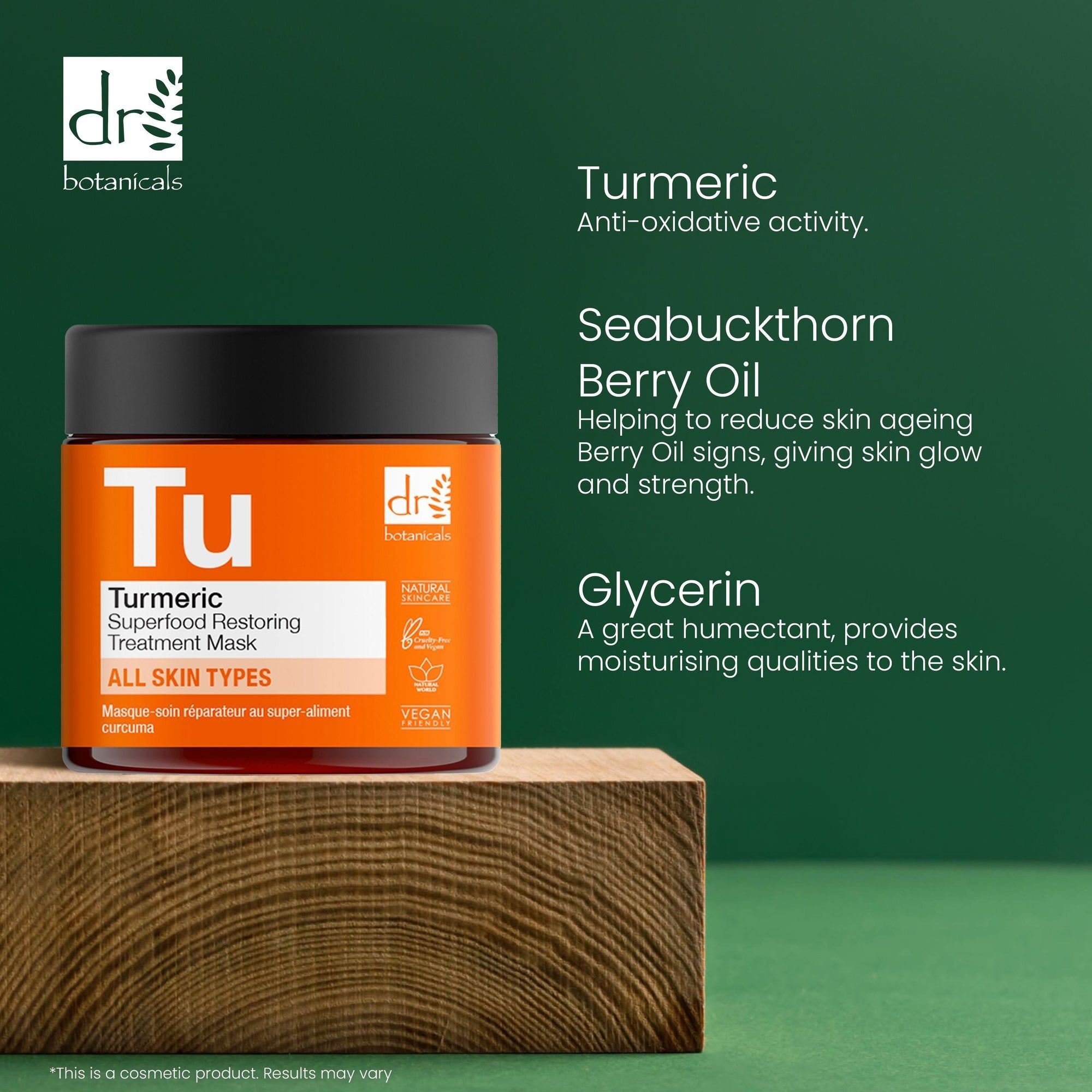 Produkt auf Holzblock. Aufschrift 'Tu' und 'Turmeric Superfood Restoring Treatment Mask'. Orangefarbenes Etikett mit Logo. Text über Inhaltsstoffe.