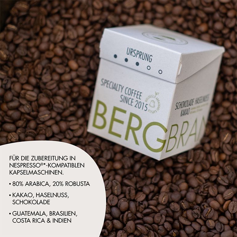 Kaffeebohnen und Verpackung. Aufschrift: BERGBRAND, Ursprung, Specialty Coffee. Text: 80% Arabica, 20% Robusta, Kakao, Haselnuss, Schokolade.