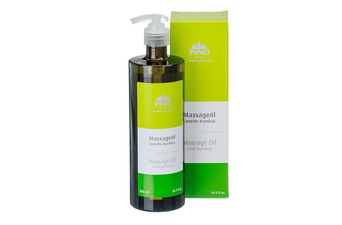 Grüne Glasflasche mit Pumpe und Karton. Aufschrift: Massageöl Limette Bambus. Marke: Pino.