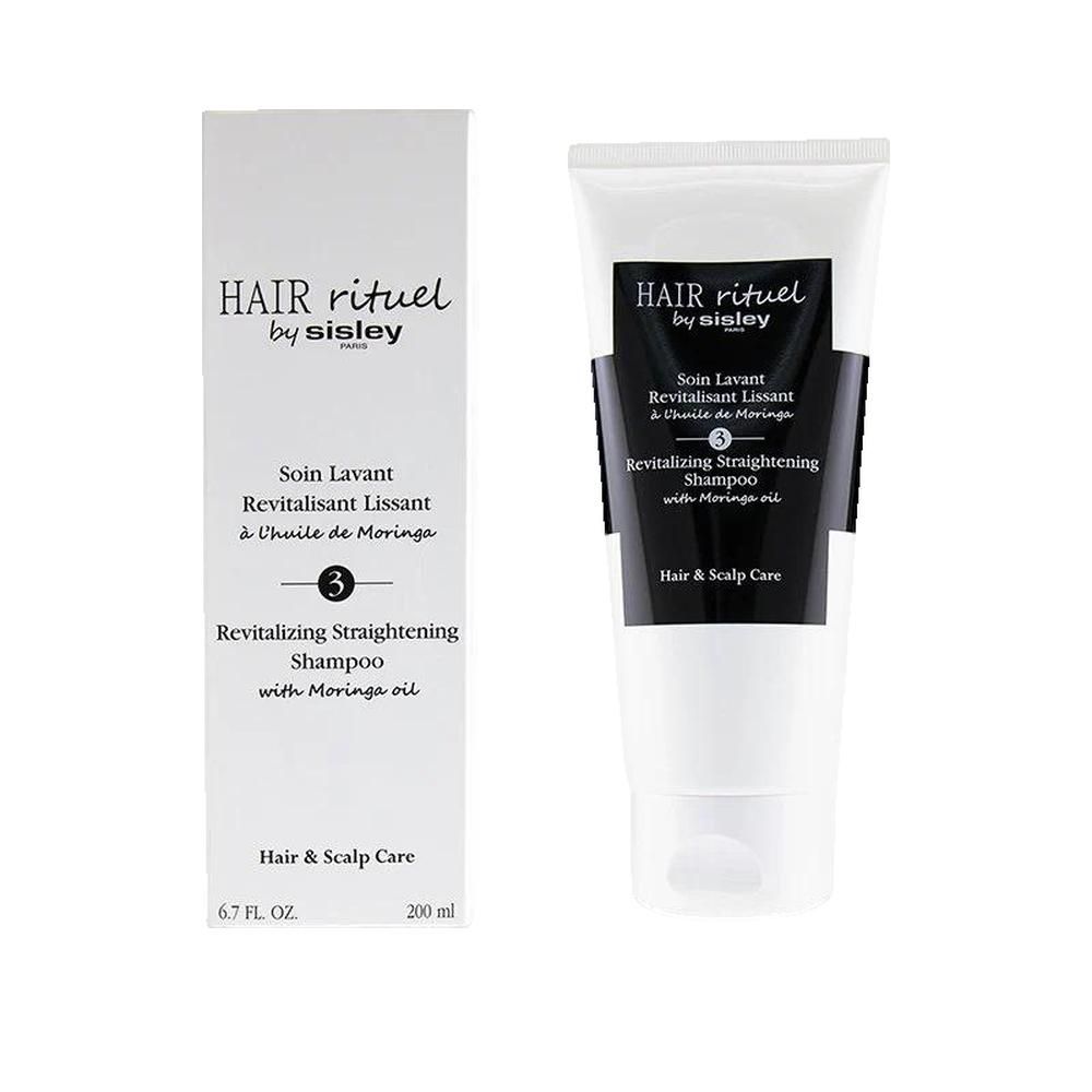 Produktverpackung und Tube. Hair Rituel by Sisley. Text: Revitalizing Straightening Shampoo. Weiße Tube, schwarzer Aufdruck.