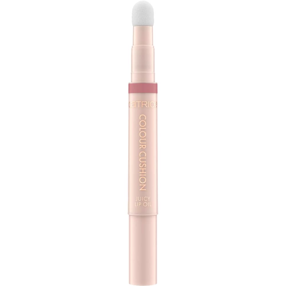 Ein rosafarbener Lippenstift-Applikator mit der Aufschrift 'COLOUR CUSHION JUICY LIP OIL'.
