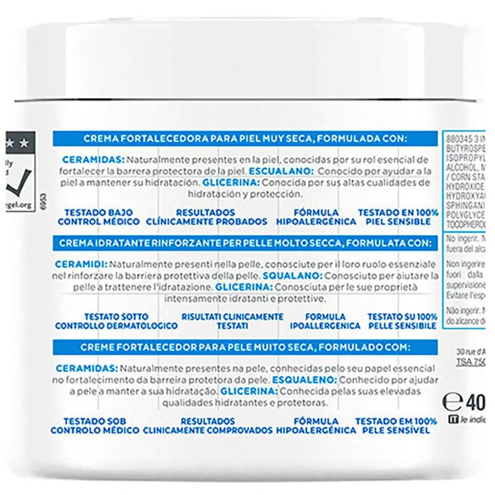 Rückseite des weißen Tiegels. Text: Creme fortificante para piel muy seca. Inhaltsstoffe: Ceramide, Squalan, Glycerin. Getestet unter medizinischer Kontrolle.