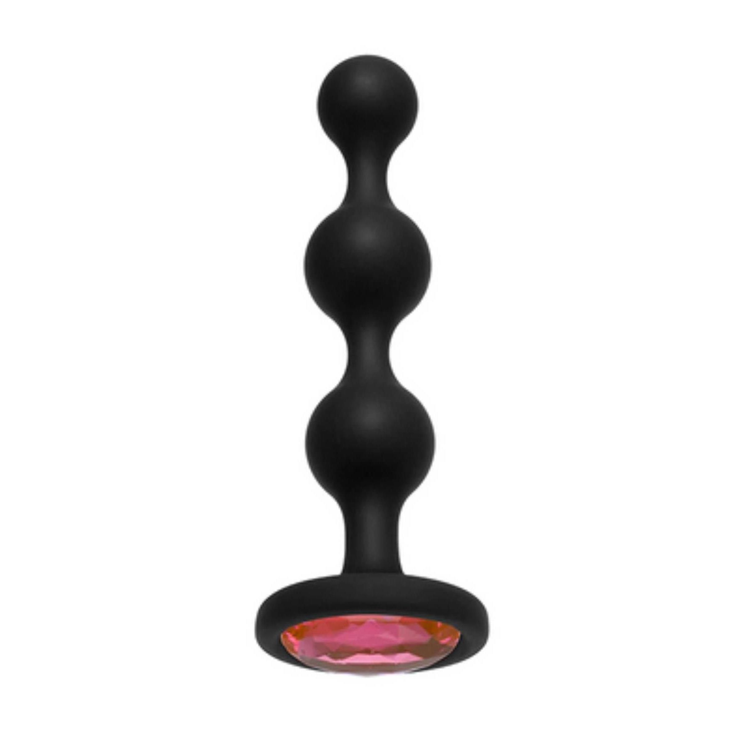 Schwarze, perlenförmige Beads mit rotem Schmuckstein. Produkt aus Silikon.