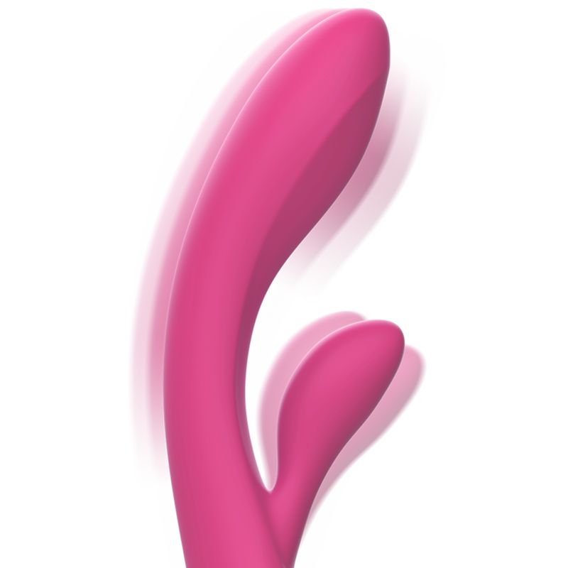 Rosa Vibrator aus Silikon. Gebogene Form mit zwei Vorsprüngen. Bewegungsunschärfe.