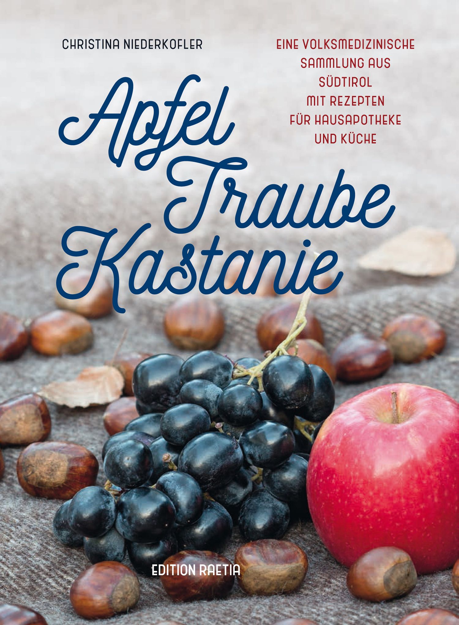 Buchcover mit Apfel, Traube, Kastanie. Titel in blauer Schrift. Früchte und Kastanien liegen auf einer Decke.