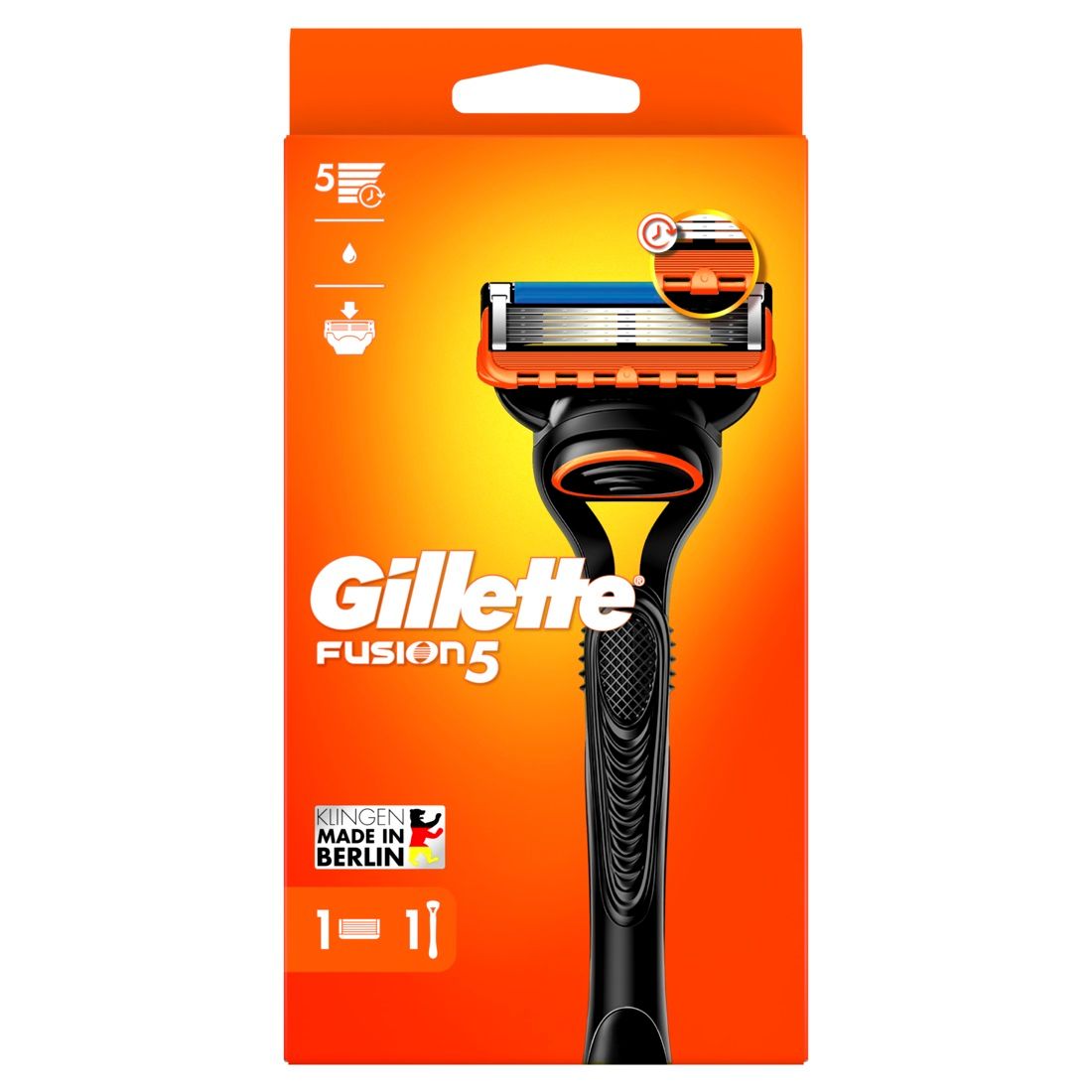Gillette Fusion5 Rasierapparat. Schwarzer Griff, orangefarbener Klingenkopf. Verpackung mit Produktabbildung. "Klingen Made in Berlin".