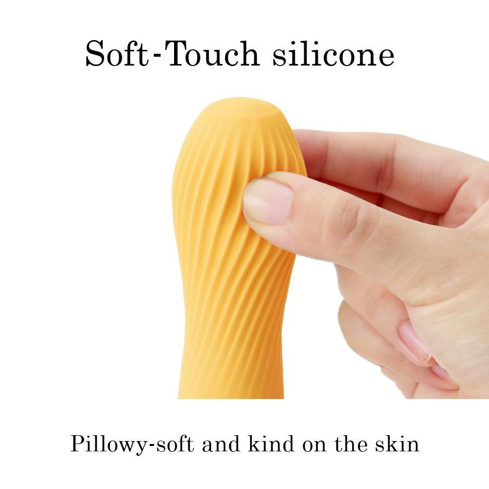 Gelber Vibrator, geriffelte Oberfläche, in Hand gehalten. Text: "Soft-Touch silicone..."