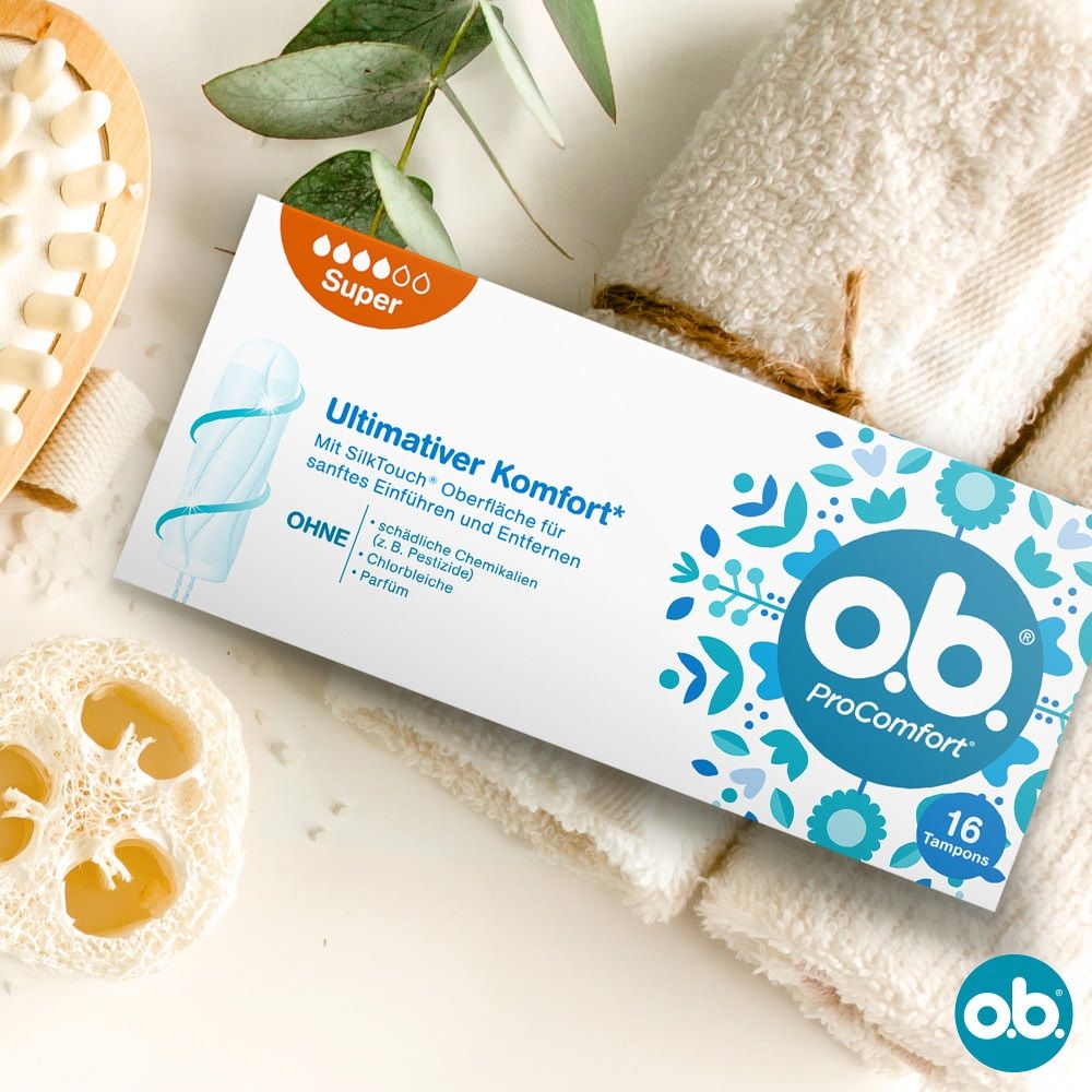 Packung o.b.® ProComfort Super. 16 Tampons. Auf Handtüchern und Schwamm. o.b.® Logo.