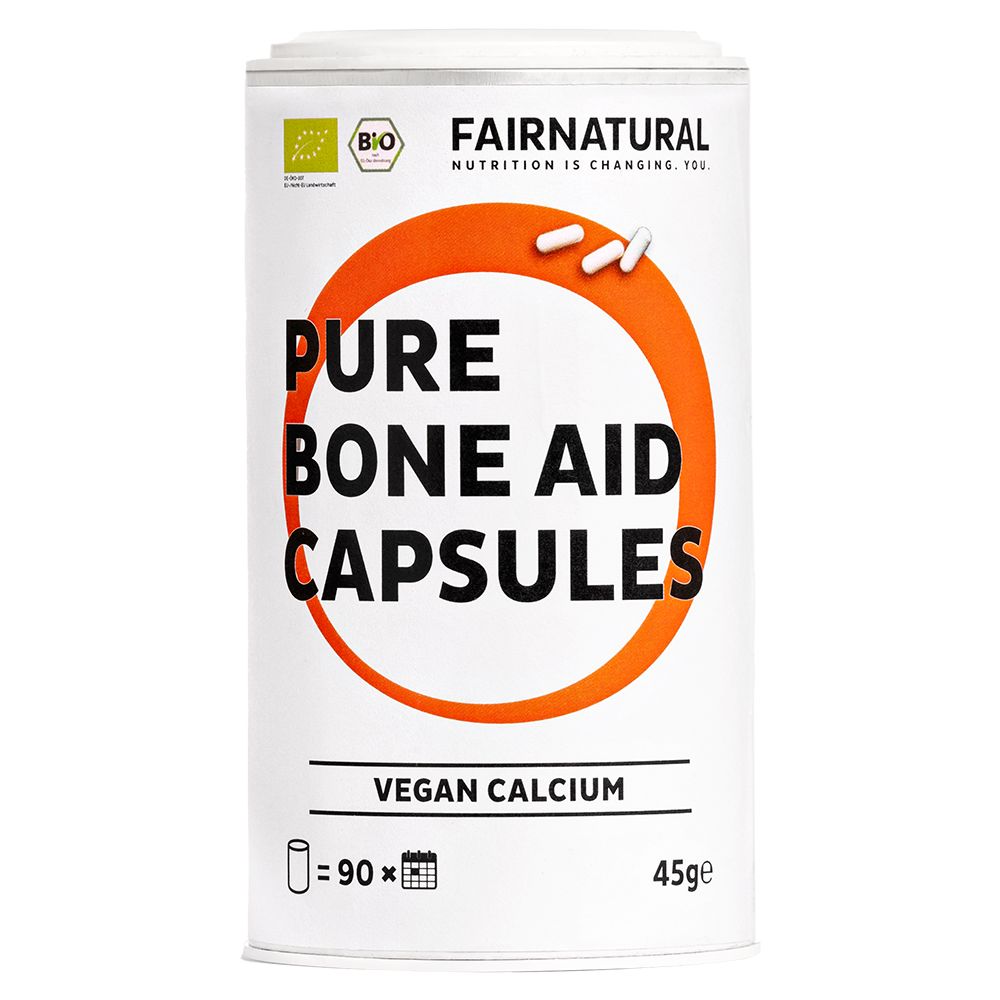 Zylinderdose mit Kapseln. Aufschrift: Pure Bone Aid Capsules, Vegan Calcium. Bio-Siegel.