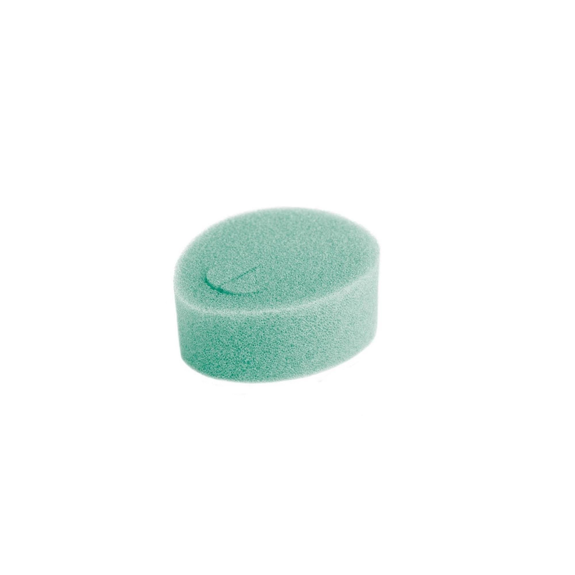Grüner, ovaler Tampon. Weiches Material. Mit einer kleinen Aussparung.