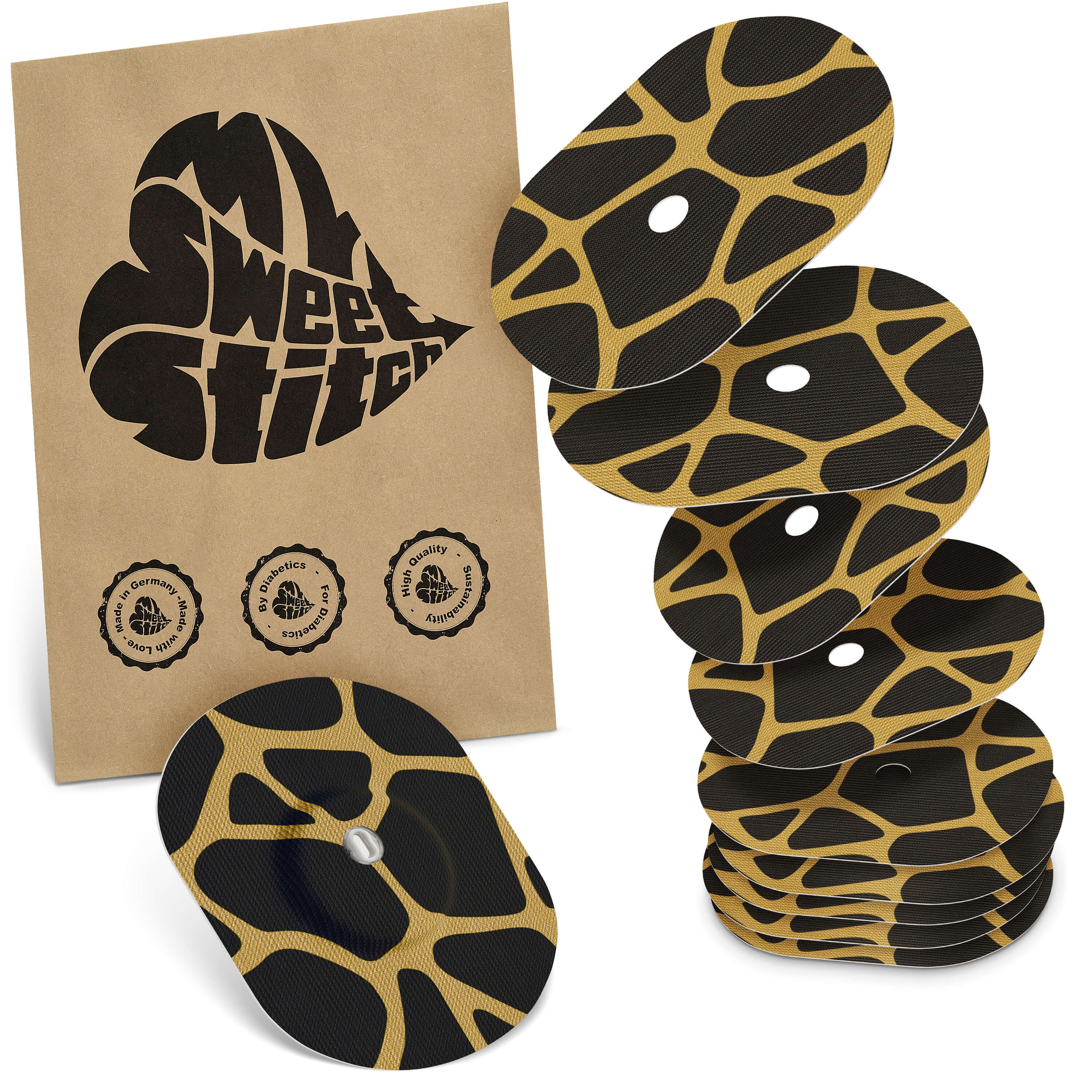 Ovale Pflaster mit schwarzem Grund und gelbem Muster. Auf brauner Verpackung steht "MySweetStitch". Mehrere Pflaster sind gestapelt.