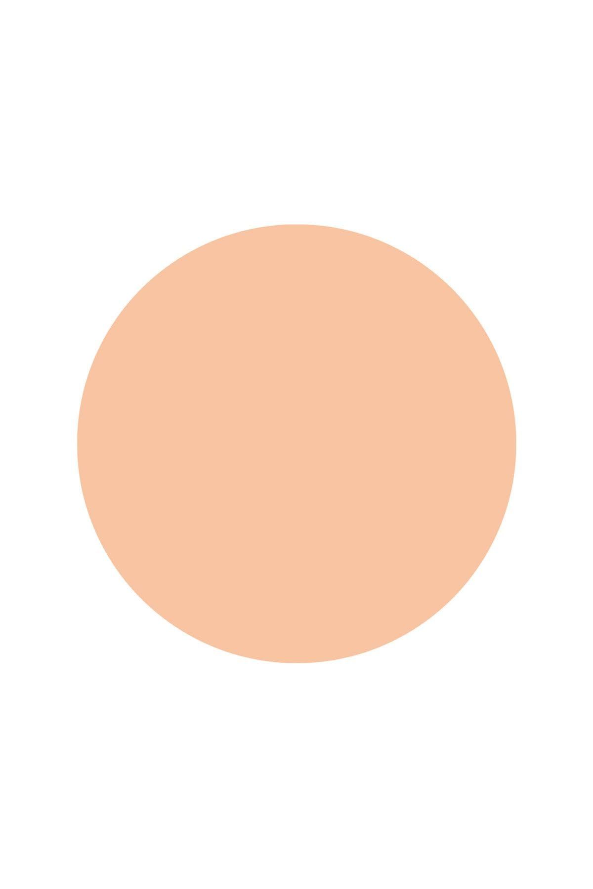 Runder, heller, cremefarbener Fleck auf weißem Hintergrund.