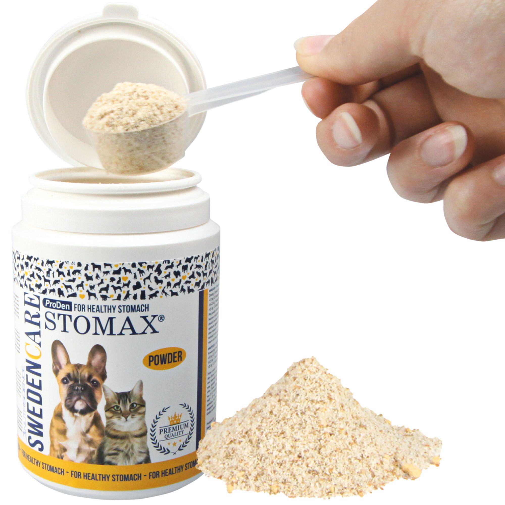 Weißes Pulver wird mit einem Löffel aus einer Dose entnommen. Auf der Dose steht Stomax, daneben ein Hund und eine Katze.