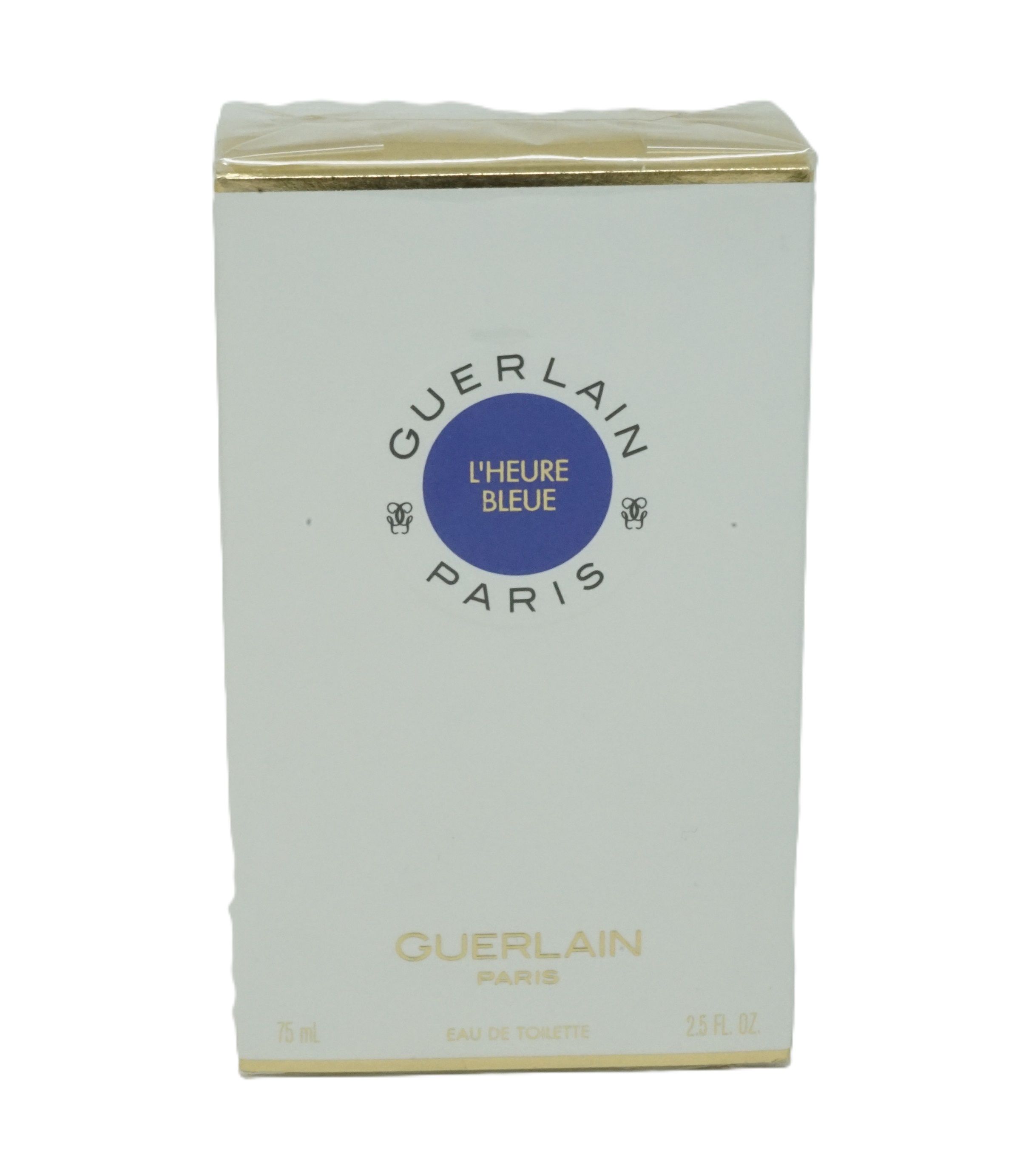 Verpackung von Guerlain L'Heure Bleue Eau de Toilette. Weißer Karton mit blauem Kreis und Text. Goldener Rand. Text: Eau de Toilette.