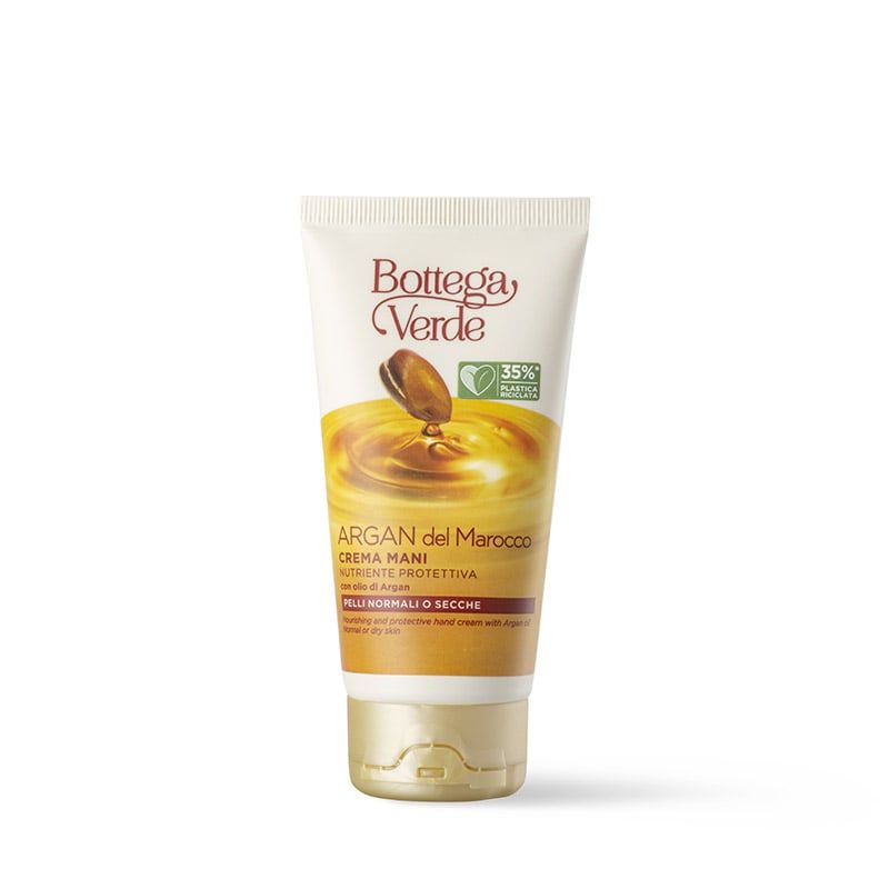 Tubo di crema mani Bottega Verde Argan del Marocco. Il tubo bianco presenta dettagli dorati e un'immagine di olio di argan. Il testo include "CREMA MANI" e "Pelli normali o secche".