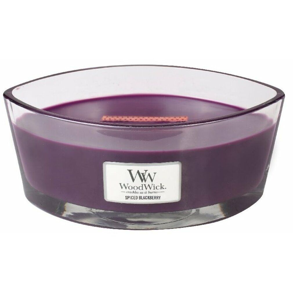 Ellipse-Kerze mit violettem Wachs in Glasbehälter. Etikett "Spiced Blackberry". WW-Logo. Holzdocht sichtbar.