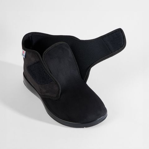 Schwarze Stiefeletten für Damen mit Klettverschluss, eine geöffnet.