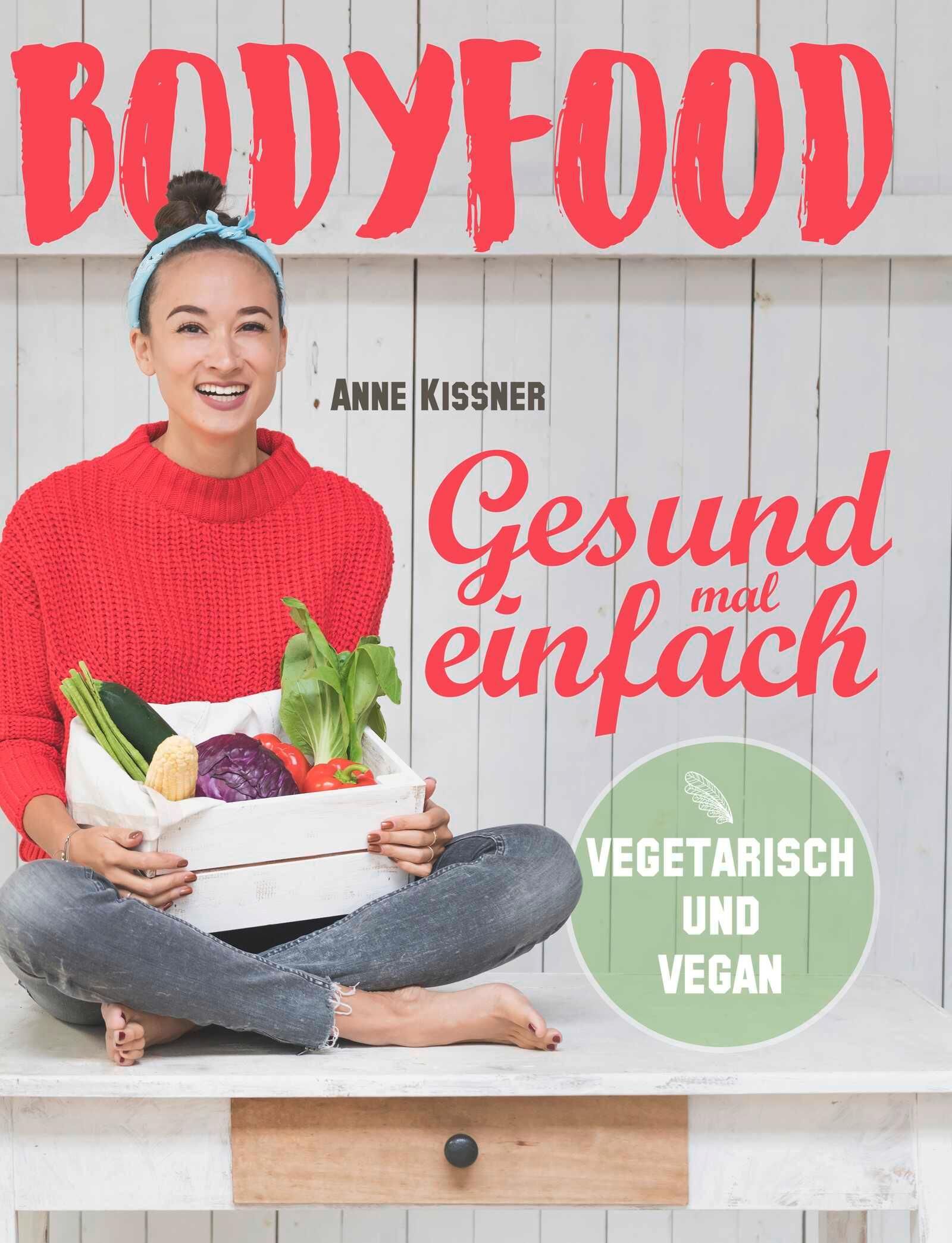 Buchcover mit Titel BODYFOOD, Autorin Anne Kissner. Frau hält Kiste mit Gemüse. Aufschrift: Gesund mal einfach, vegetarisch und vegan.