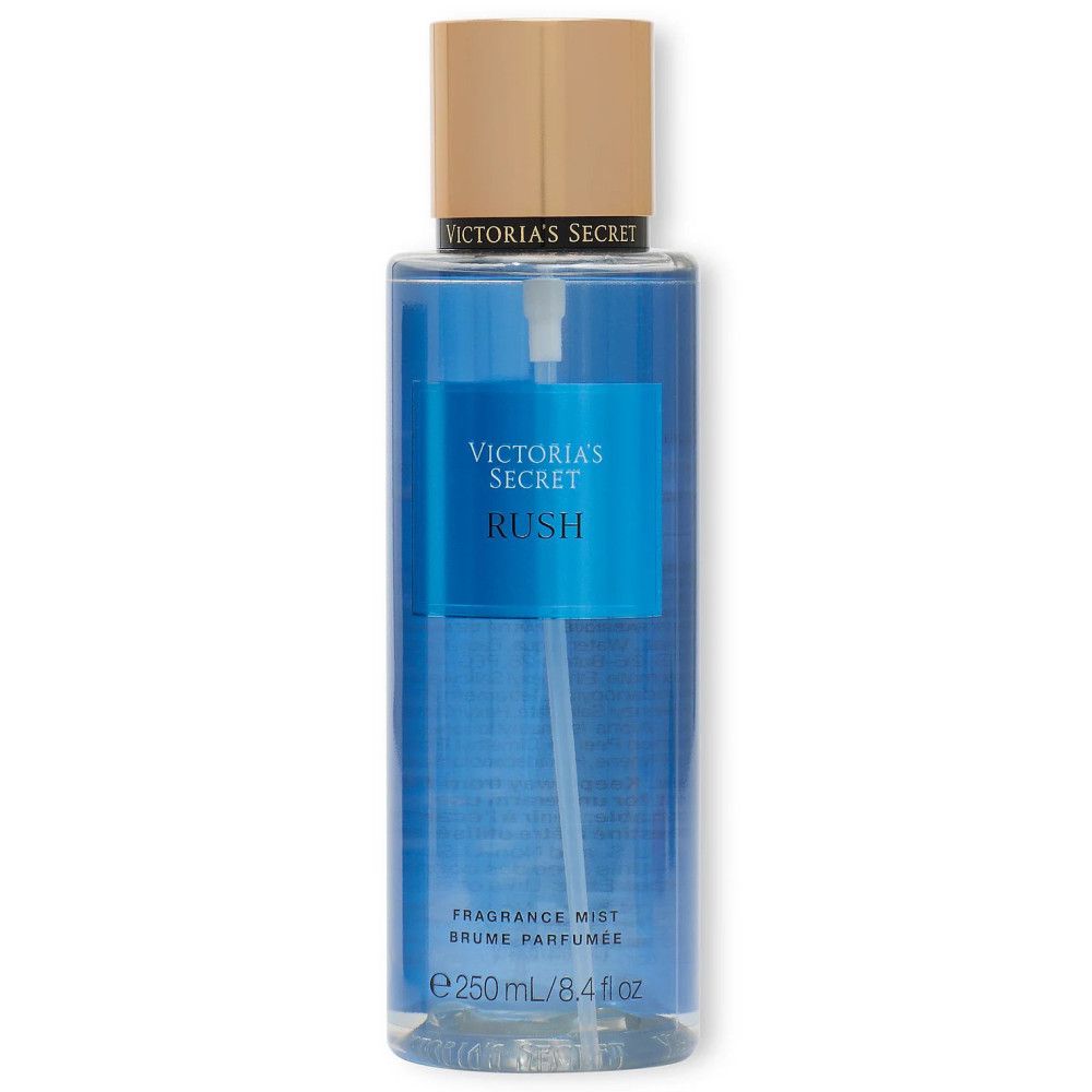 Blauer Flakon mit Sprühkopf und Aufschrift 'Victoria's Secret Rush'. Etikett mit 'Fragrance Mist'.