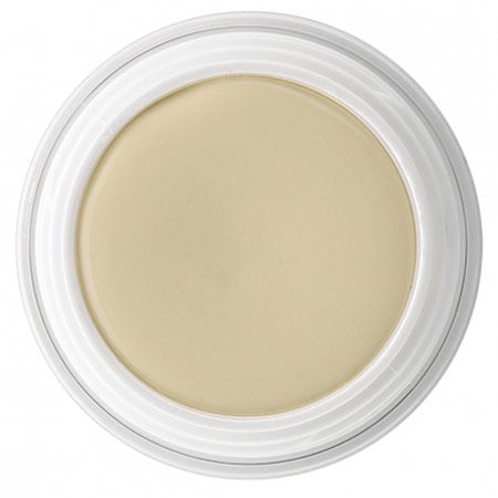 Creme in einem runden, transparenten Tiegel mit weißem Deckel. Die Creme hat eine helle, sandfarbene Tönung.