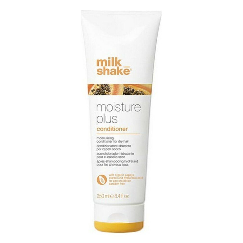 Weiße Tube mit orangefarbenem Deckel. Aufschrift: milk_shake moisture plus conditioner. Text in mehreren Sprachen.