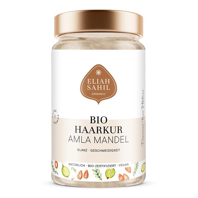 Glasbehälter mit goldfarbenem Deckel. Aufschrift: Eliah Sahil Organic, Bio Haarkur Amla Mandel. Vegan, bio-zertifiziert.