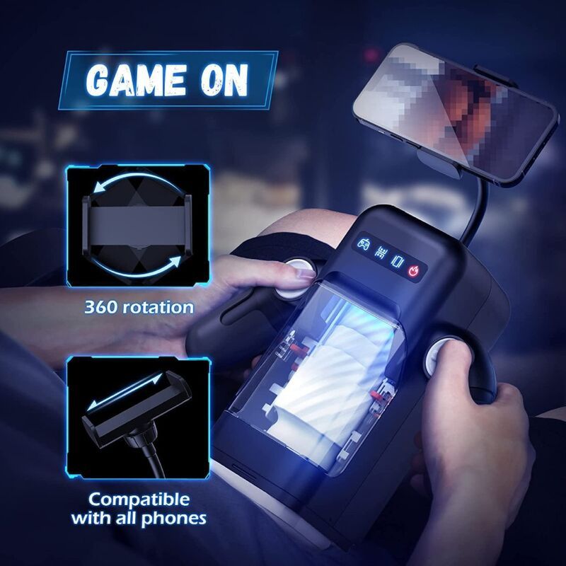 Schwarzes Gerät mit Smartphone. Bedienelemente. Transparente Kammer. Text: GAME ON, 360 rotation, Compatible with all phones.