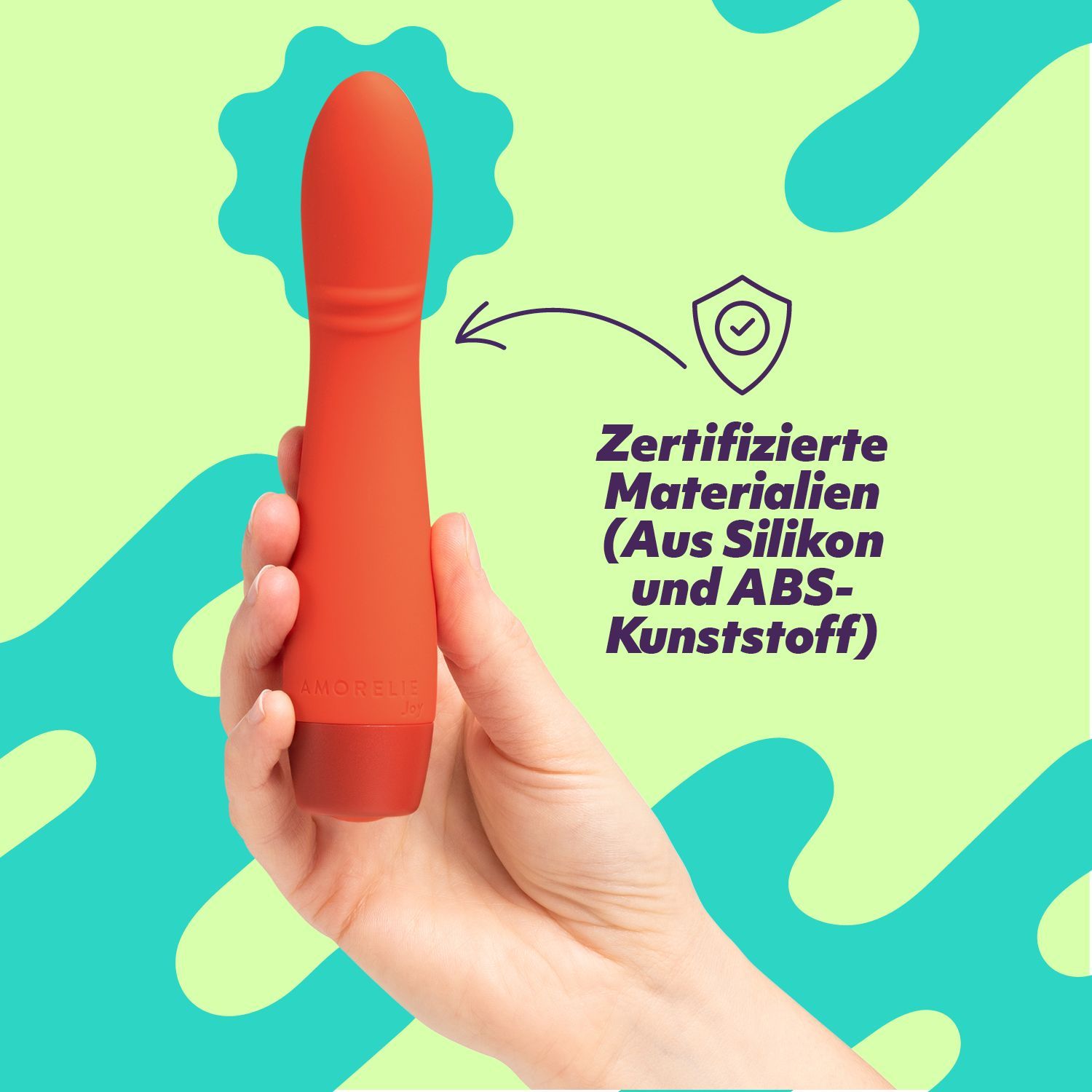 Roter Vibrator in Hand. Text: Zertifizierte Materialien (Aus Silikon und ABS-Kunststoff).