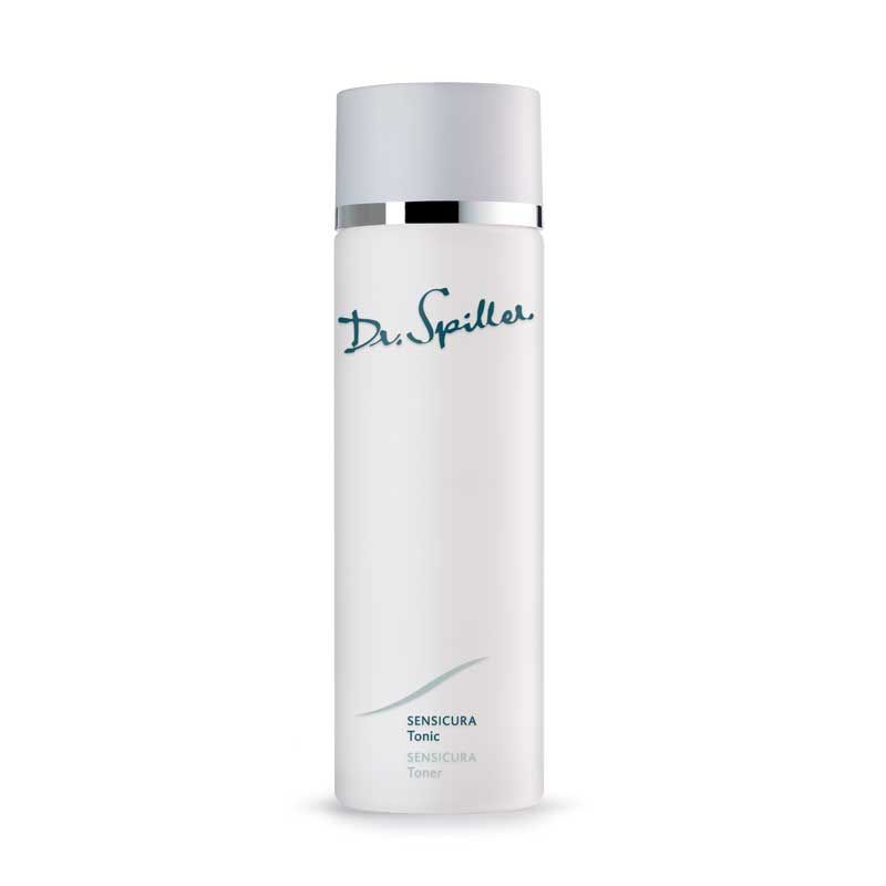 Zylindrische Flasche mit weißem Deckel und silbernem Ring. Aufschrift: Dr. Spiller, Sensicura Tonic.