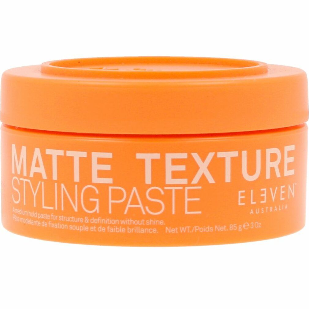 Orangene Dose mit weißem Schriftzug: MATTE TEXTURE STYLING PASTE. Marke: ELEVEN AUSTRALIA. Text darunter.