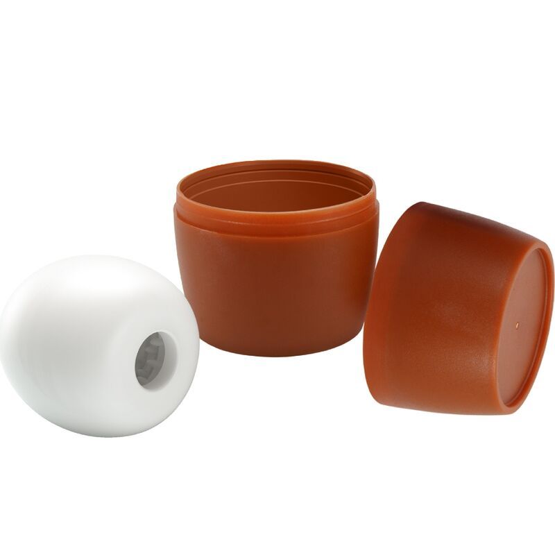 Masturbator in Eiform, neben geöffnetem braunen Behälter. Weißes Produkt, brauner Behälter.