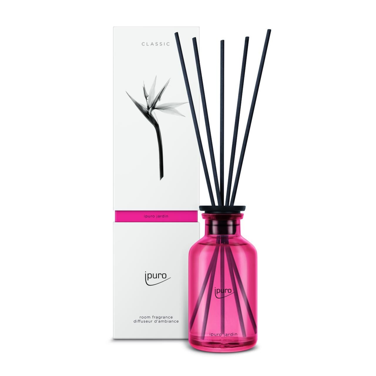 Rosa Glasflasche mit schwarzen Stäbchen und Verpackung. Aufschrift: Ipuro, Classic Jardin Raumduft.