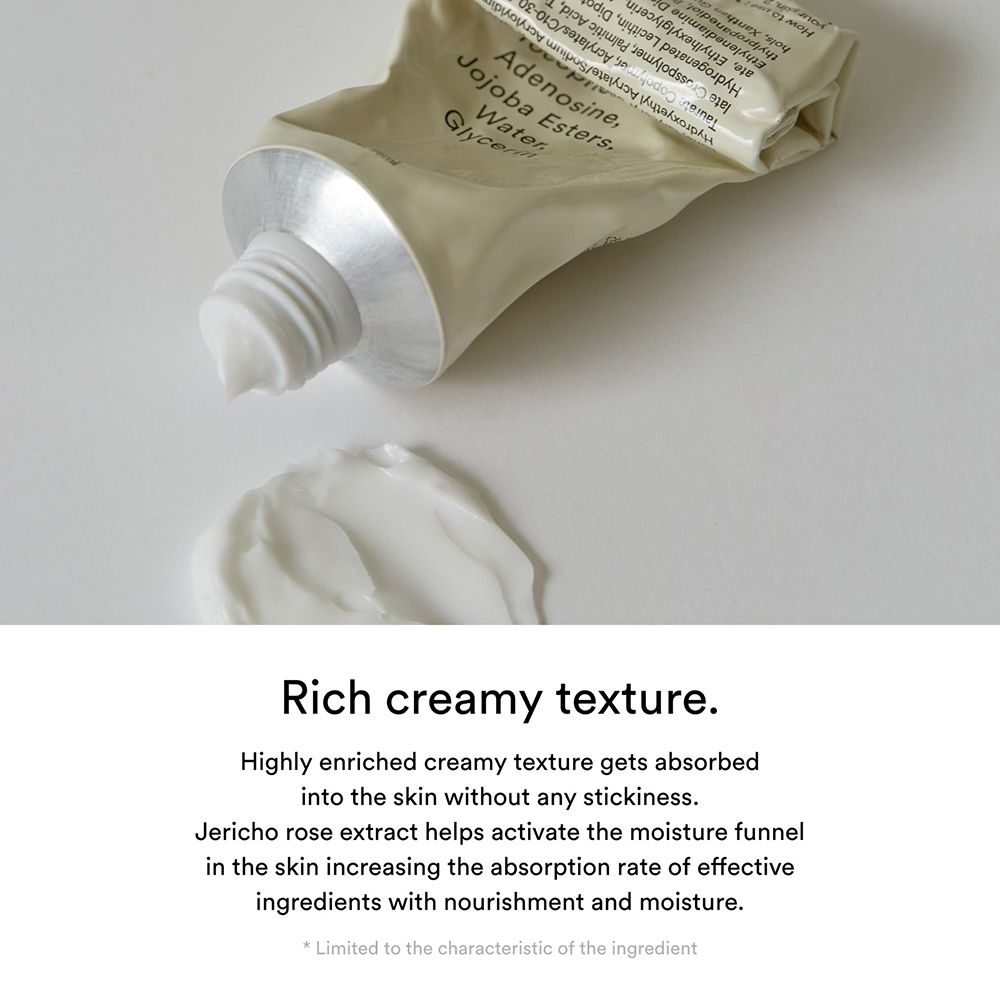 Nahaufnahme der Creme, die aus einer Tube gedrückt wird. Text: Jericho Rose Extract. Reichhaltige, cremige Textur.