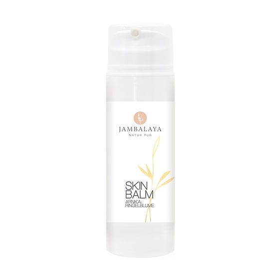 Weißer Spender mit Produktetikett. Aufschrift: Jambalaya Natur Pur, Skin Balm, Arnika-Ringelblume. Gelbe Pflanzenillustration.
