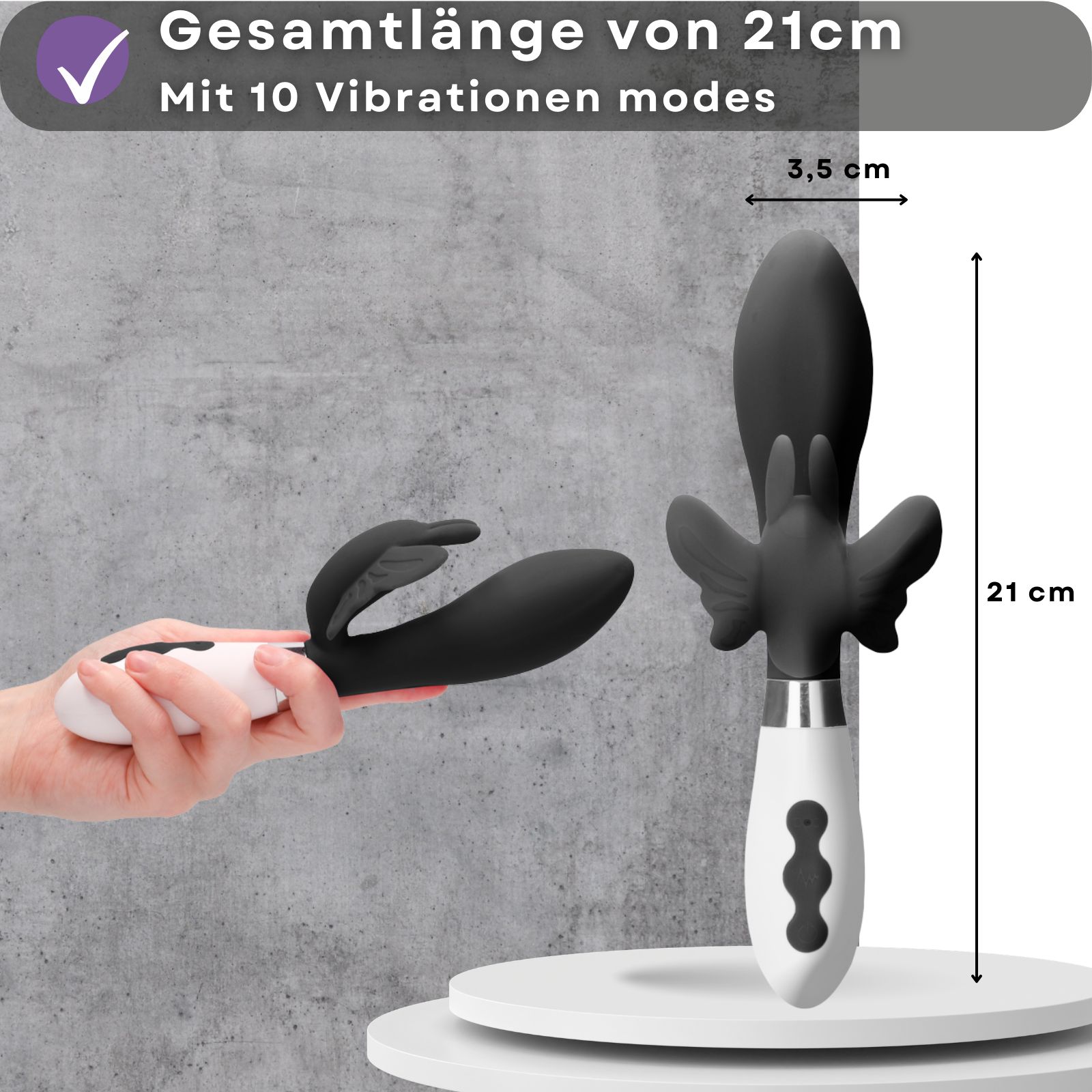 Vibrator, 21 cm lang, 3,5 cm Durchmesser. 10 Vibrationsmodi. Schwarzer Kopf, weißer Griff. Hand hält das Produkt.