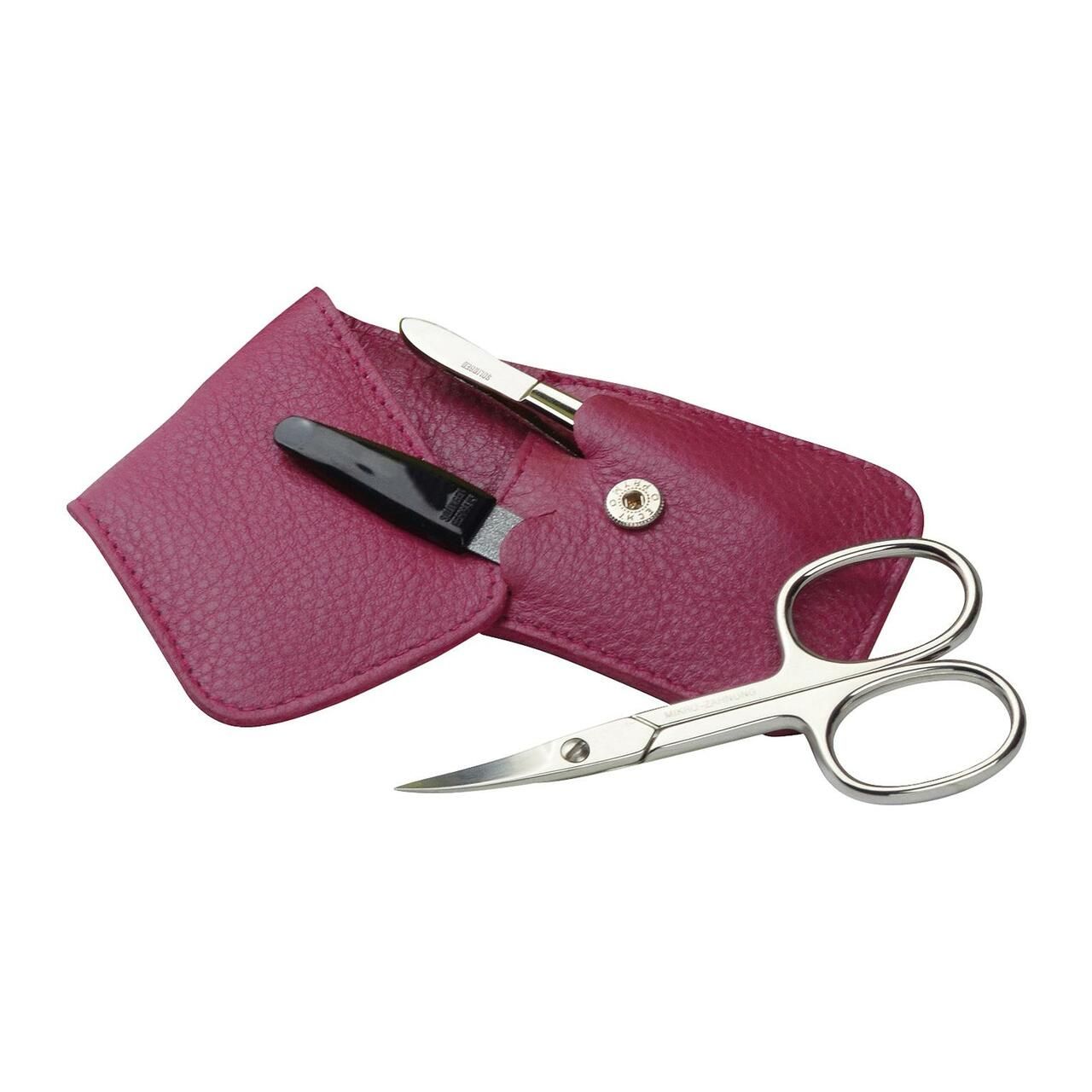 Offenes Maniküre-Etui mit Nagelschere, Feile und Pinzette. Pinkfarbenes Leder. Vernickelte Werkzeuge.
