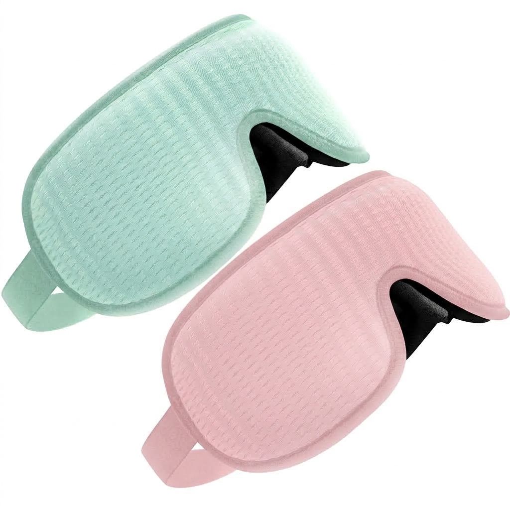 Zwei Schlafmasken, eine mintgrün, eine rosa, mit verstellbarem Riemen.