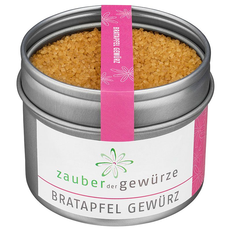 Runde Dose mit Bratapfel Gewürz. Rosa Etikett mit Schriftzug. Deckel mit Gewürz gefüllt. Weißes Etikett mit Logo und Produktname.