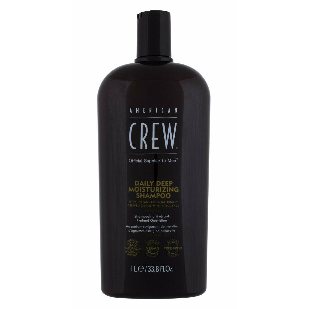 Braune Flasche American Crew Shampoo. Schwarzer Deckel. Text: Daily Deep Moisturizing Shampoo. 1L/33.8 fl oz.