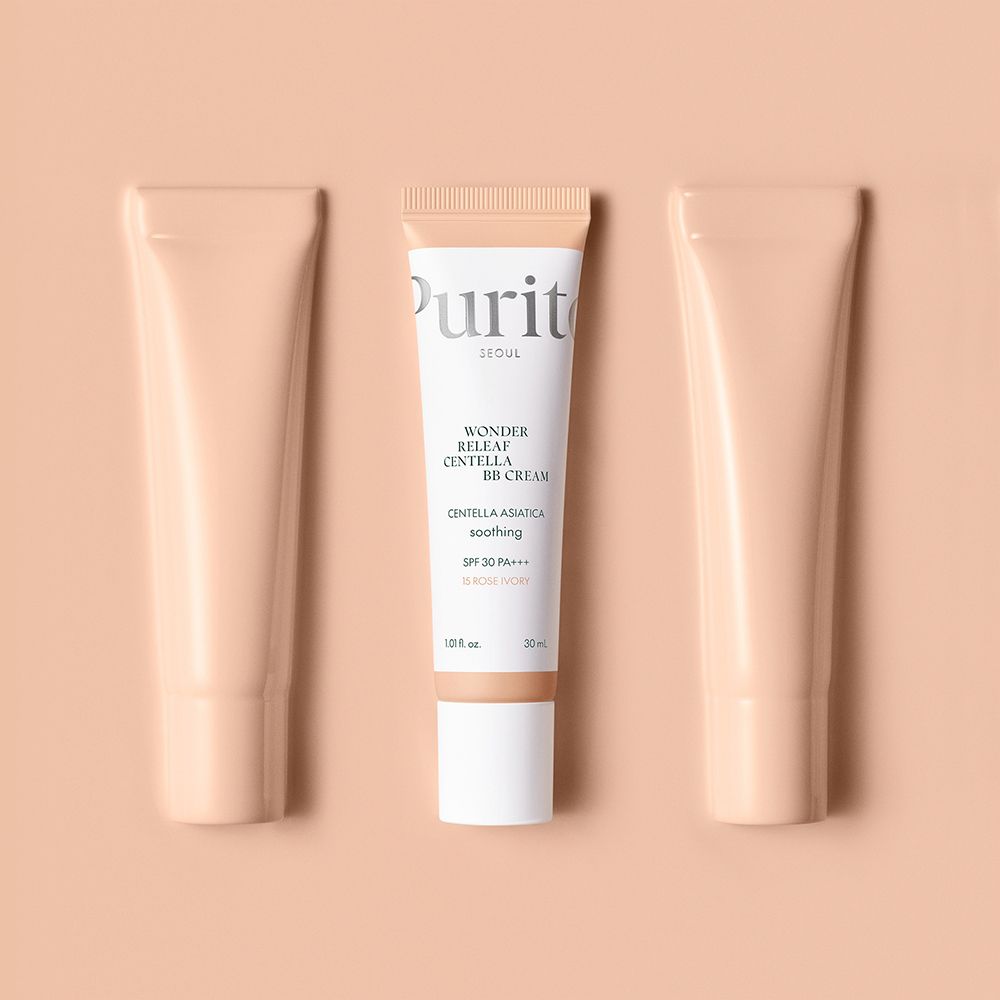 Purito Wonder Releaf Centella BB Cream, 15 Rose Ivory, flankiert von zwei leeren Tuben.