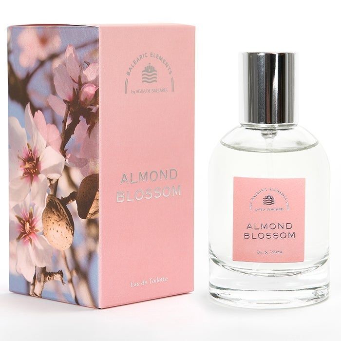 Rosa Schachtel und Flakon. Auf der Schachtel steht "ALMOND BLOSSOM". Auf dem Flakon steht "ALMOND BLOSSOM".