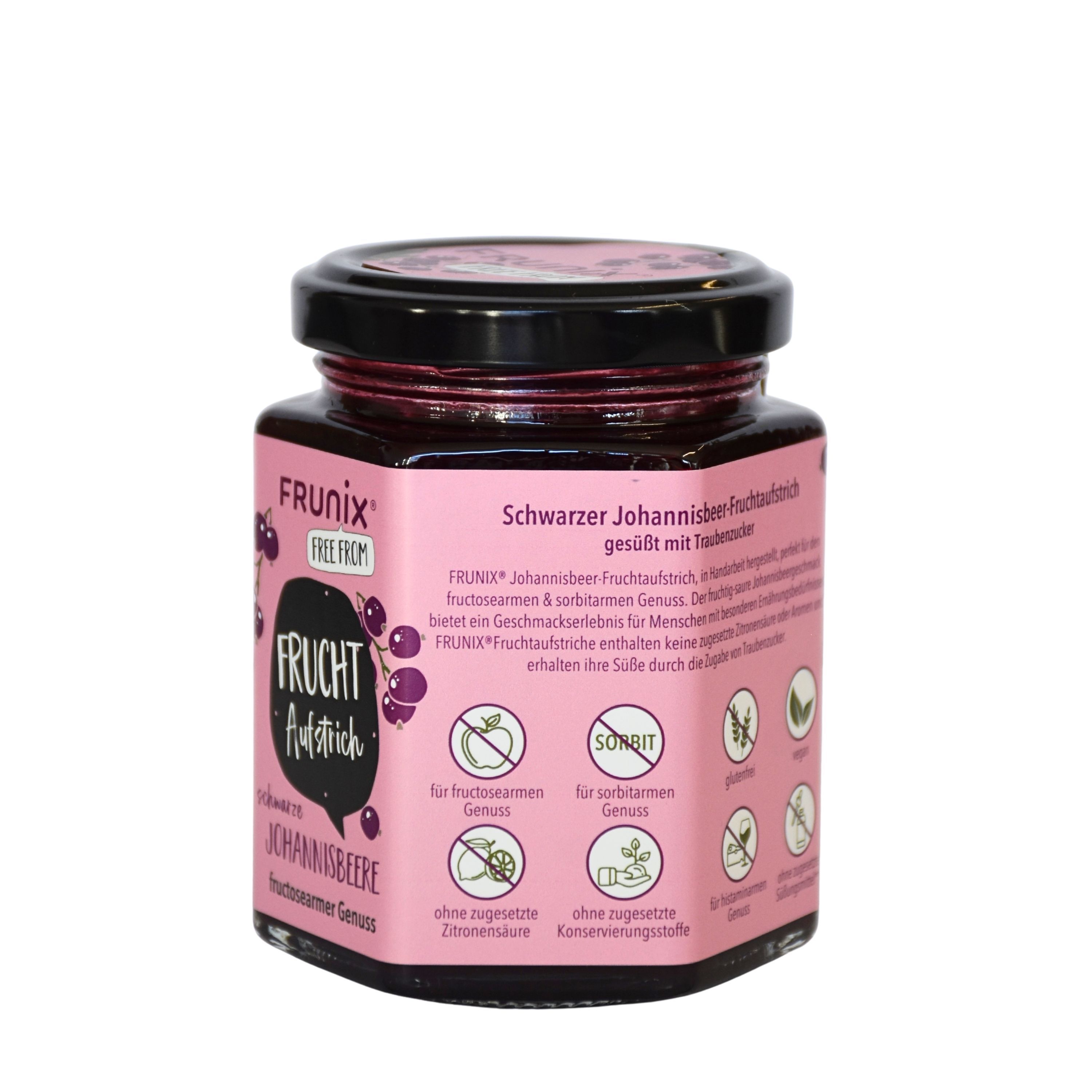 Glas mit schwarzem Johannisbeer-Fruchtaufstrich. Rosa Etikett mit Produktname, Marke und Symbolen. Schwarzer Deckel.