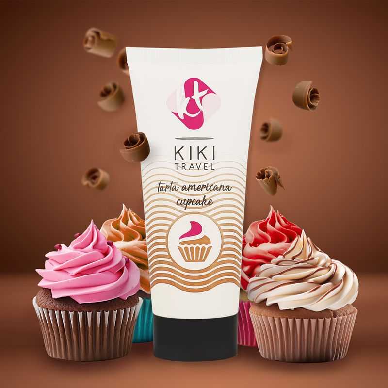 Tube Gleitgel "KIKI TRAVEL" mit Aufdruck "tarta americana cupcake". Umgeben von Cupcakes und Schokoladenlocken.
