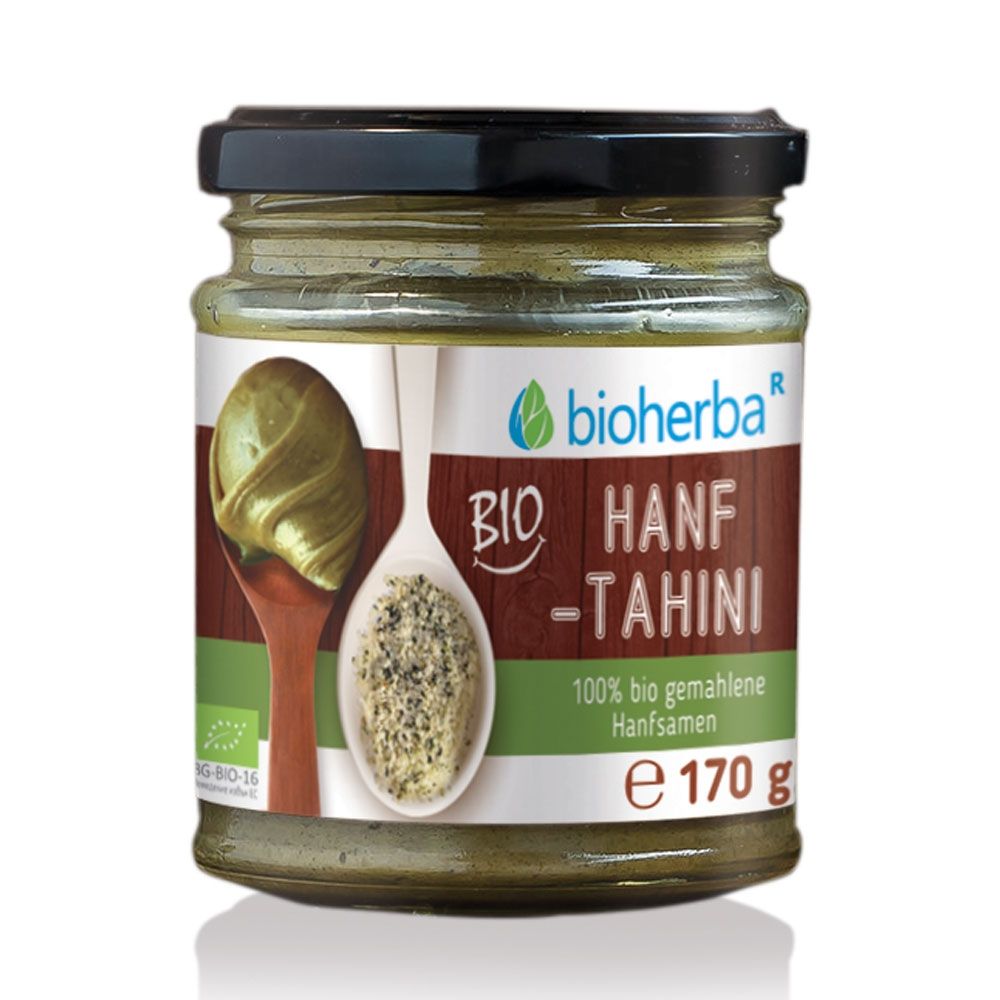 Glas mit Bio Hanf Tahini. Schwarzer Deckel. Etikett mit Logo, Produktname und Inhaltsangabe. E 170 g. Bio-Zertifizierung.